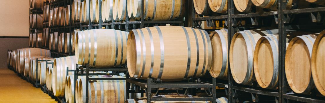 Wine-Inventory-Header Wine barrels stacked on racks