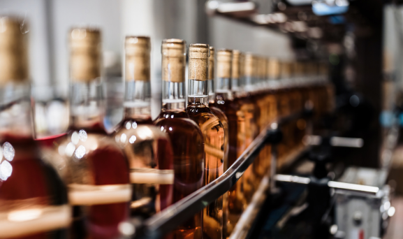 Wine-Inventory-Valuation Wine bottling line full of bottles of rose