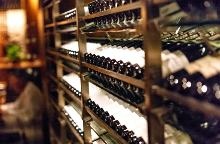 Wine-inventory Wine collection on wooden shelves